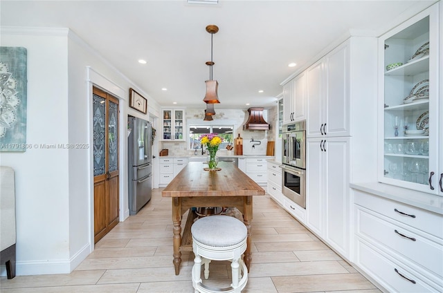 18525 SW 90th Ct, Cutler Bay, FL 33157 - kitchen featuring appliances with stainless steel finishes, wooden counters, recessed lighting, ornamental molding, and glass insert cabinets