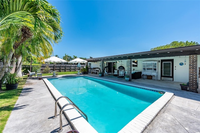 view of pool with a patio, a fenced in pool, and a fenced backyard