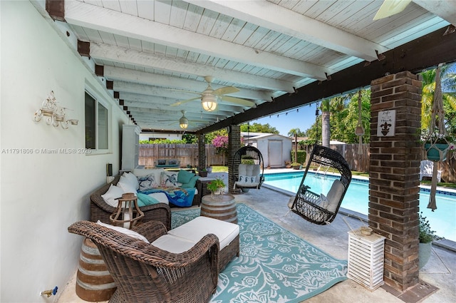 view of patio featuring ceiling fan, an outbuilding, a fenced in pool, a fenced backyard, and a storage unit