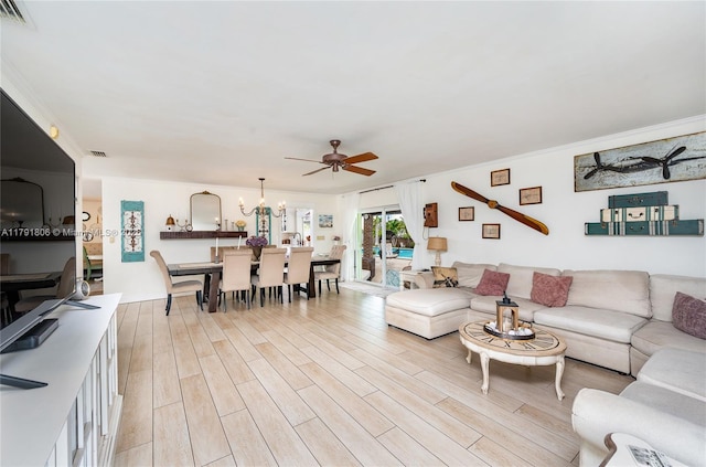 18525 SW 90th Ct, Cutler Bay, FL 33157 - living area with light wood-type flooring, ceiling fan with notable chandelier, and visible vents
