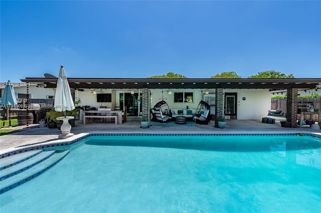pool featuring a patio, an outdoor living space, a ceiling fan, and fence