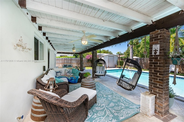view of patio featuring a fenced backyard, a shed, a fenced in pool, a ceiling fan, and an outbuilding