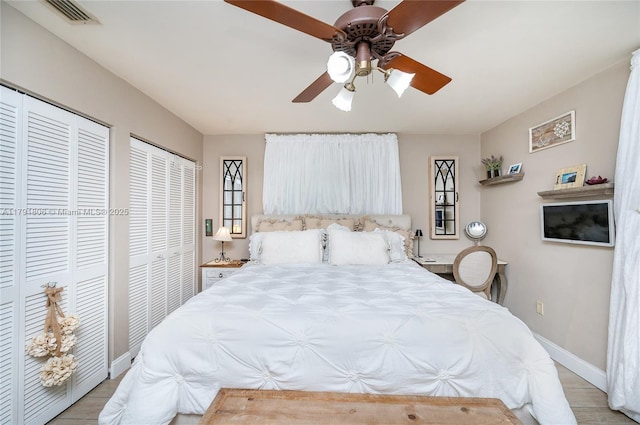 18525 SW 90th Ct, Cutler Bay, FL 33157 - bedroom featuring multiple closets, baseboards, a ceiling fan, and visible vents