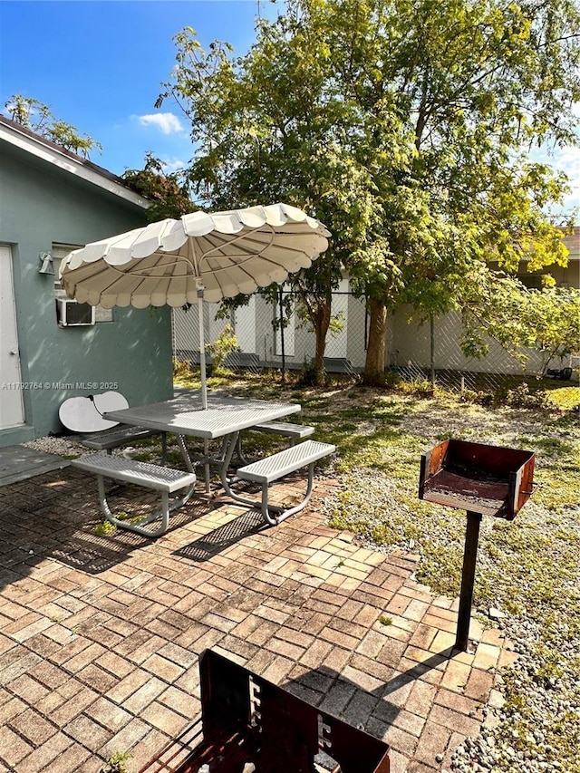 view of patio / terrace featuring fence and outdoor dining space