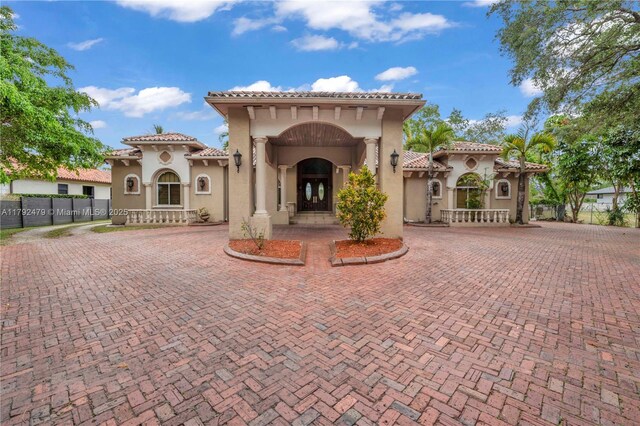 7761 SW 122nd Ave, Miami, FL 33183 - view of front of property with stucco siding, a tiled roof, and fence