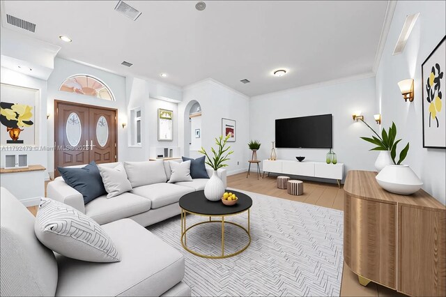 7761 SW 122nd Ave, Miami, FL 33183 - living area with wood finished floors, recessed lighting, baseboards, arched walkways, and ornamental molding