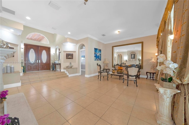 7761 SW 122nd Ave, Miami, FL 33183 - tiled foyer entrance with arched walkways, baseboards, ornamental molding, and recessed lighting