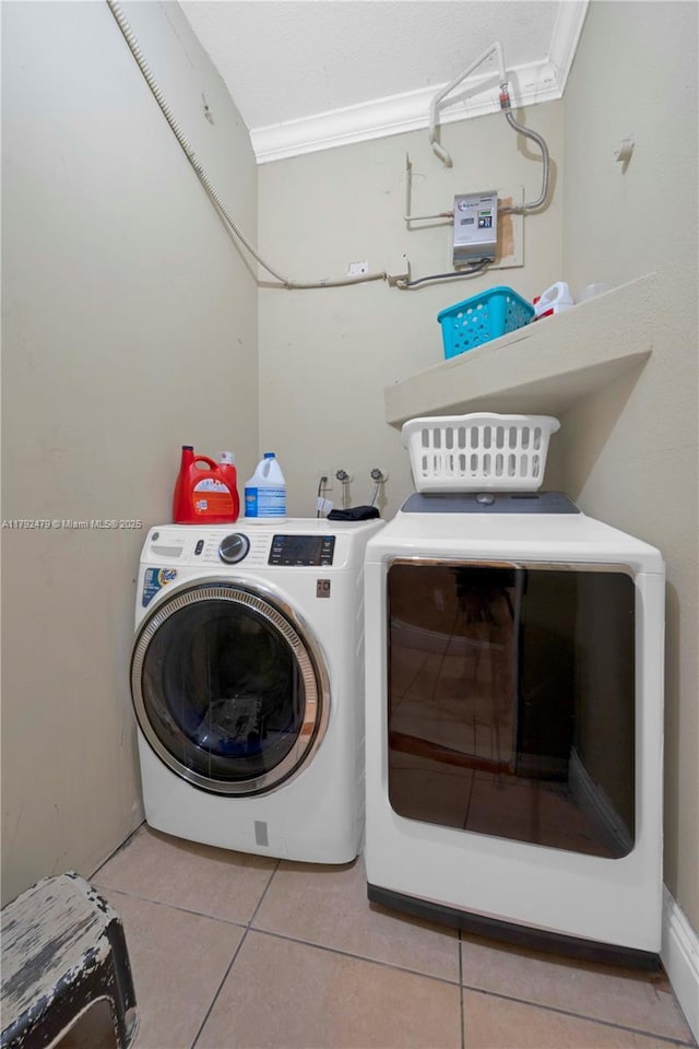 7761 SW 122nd Ave, Miami, FL 33183 - laundry area featuring independent washer and dryer, crown molding, and tile patterned flooring