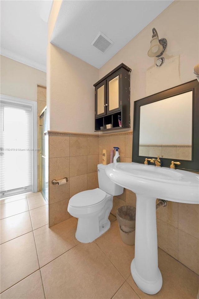 7761 SW 122nd Ave, Miami, FL 33183 - full bath with tile walls, a stall shower, toilet, and tile patterned floors