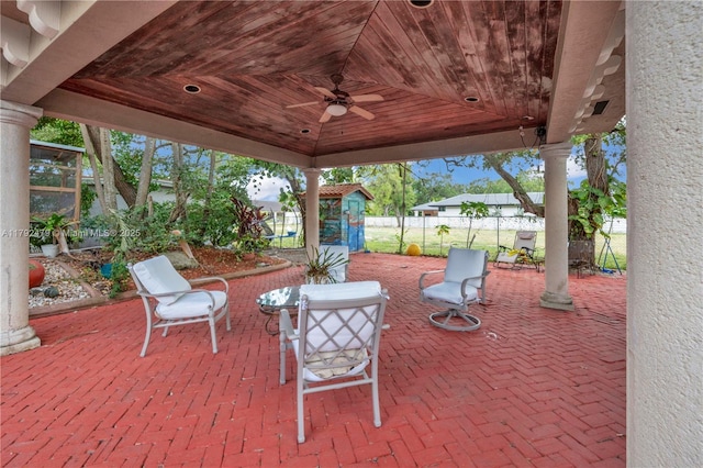 7761 SW 122nd Ave, Miami, FL 33183 - view of patio / terrace with an outdoor structure, ceiling fan, a shed, and fence