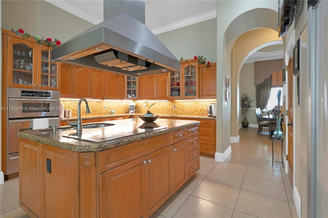 7761 SW 122nd Ave, Miami, FL 33183 - kitchen featuring ventilation hood, electric cooktop, a kitchen island with sink, crown molding, and tasteful backsplash