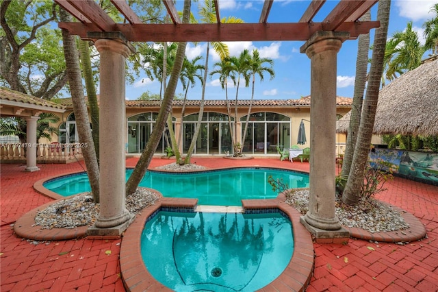7761 SW 122nd Ave, Miami, FL 33183 - view of swimming pool with a pergola, a pool with connected hot tub, and a patio