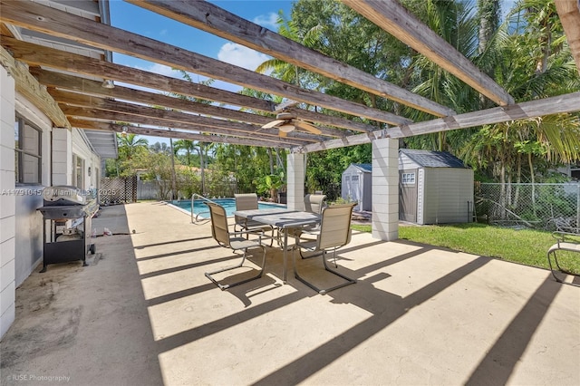 view of patio / terrace with outdoor dining area, a storage shed, an outdoor structure, a fenced backyard, and a pergola