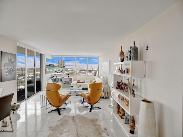 living room with expansive windows and tile patterned flooring
