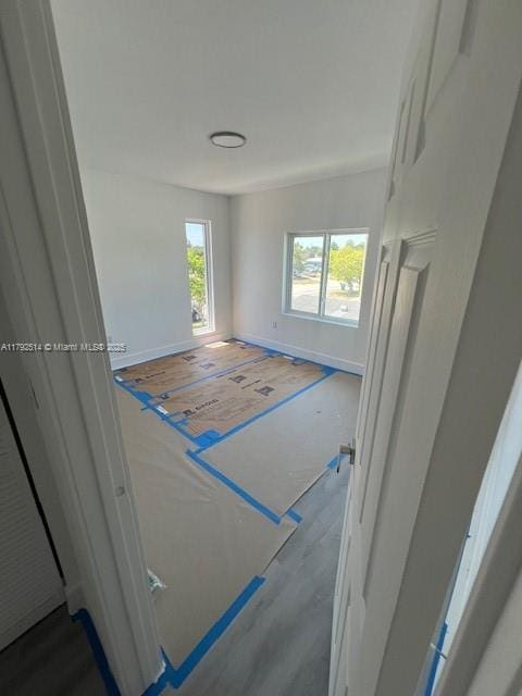 spare room featuring dark wood-type flooring