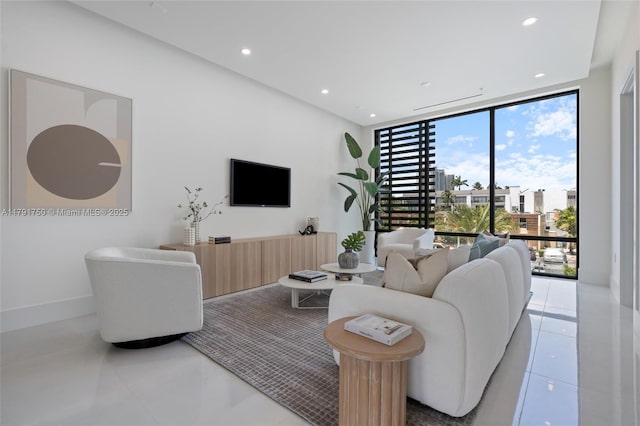 4008 NE 167th St Unit 6, North Miami Beach, FL 33160 - living area featuring light tile patterned floors, recessed lighting, and expansive windows