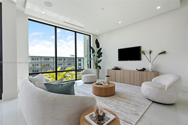 4008 NE 167th St Unit 6, North Miami Beach, FL 33160 - living room with recessed lighting and a wall of windows