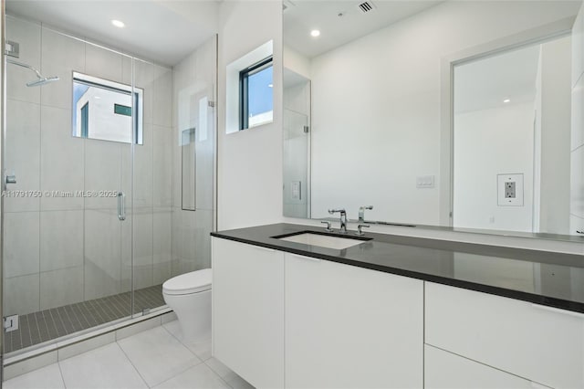 4008 NE 167th St Unit 6, North Miami Beach, FL 33160 - bathroom with tile patterned flooring, a shower stall, vanity, toilet, and recessed lighting
