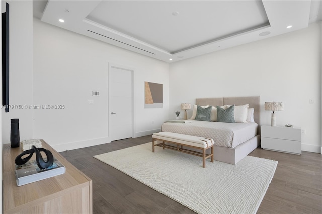 4008 NE 167th St Unit 6, North Miami Beach, FL 33160 - bedroom featuring a tray ceiling, recessed lighting, and wood finished floors