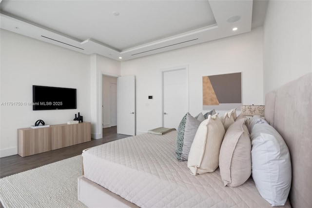 4008 NE 167th St Unit 6, North Miami Beach, FL 33160 - bedroom featuring recessed lighting, a raised ceiling, and wood finished floors