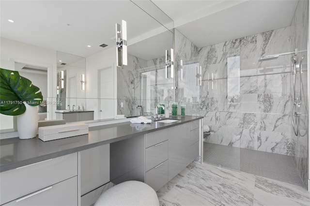 4008 NE 167th St Unit 6, North Miami Beach, FL 33160 - bathroom with visible vents, marble finish floor, a marble finish shower, and vanity