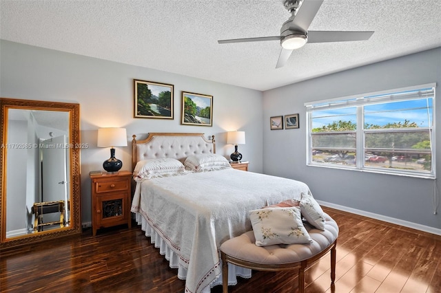 bedroom featuring baseboards, a ceiling fan, a textured ceiling, and wood finished floors