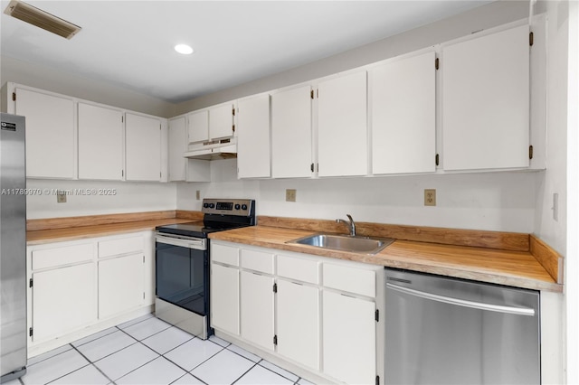 kitchen with visible vents, stainless steel appliances, a sink, light countertops, and under cabinet range hood