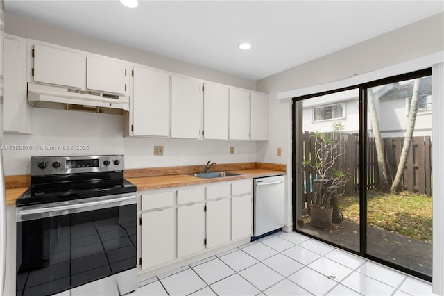 kitchen featuring white cabinets, a sink, light countertops, stainless steel appliances, and under cabinet range hood