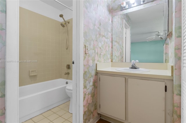full bath featuring tile patterned flooring, vanity, toilet, shower / bathtub combination, and wallpapered walls