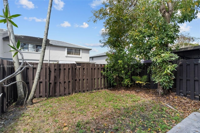view of yard with a fenced backyard