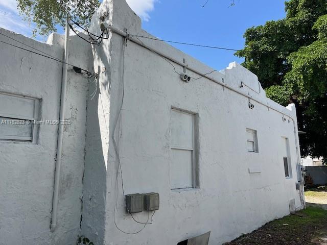 view of property exterior with stucco siding