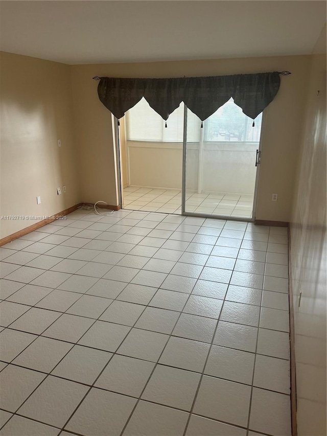 2900 N Pine Island Rd Unit 307, Sunrise, FL 33322 - spare room featuring light tile patterned flooring and baseboards