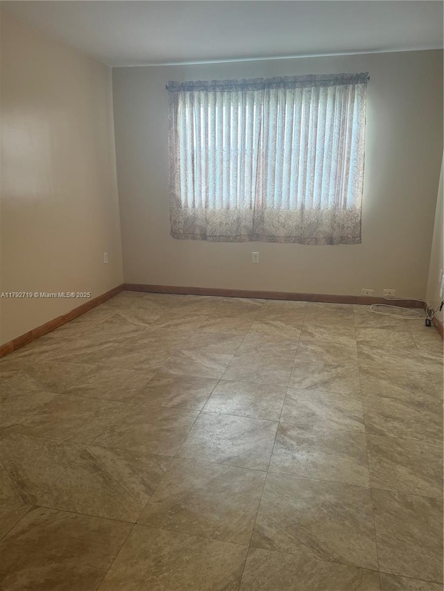 2900 N Pine Island Rd Unit 307, Sunrise, FL 33322 - spare room featuring baseboards