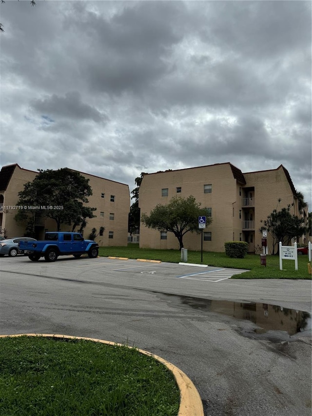 2900 N Pine Island Rd Unit 307, Sunrise, FL 33322 - view of property with uncovered parking