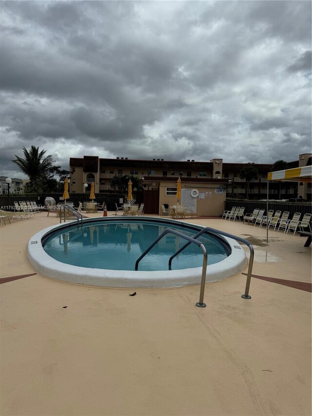 2900 N Pine Island Rd Unit 307, Sunrise, FL 33322 - community pool featuring a patio area and fence