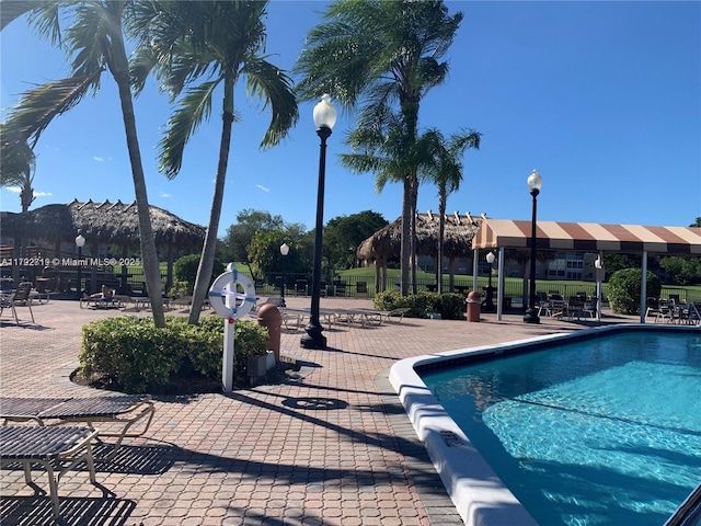 2900 N Pine Island Rd Unit 307, Sunrise, FL 33322 - pool featuring a patio and fence