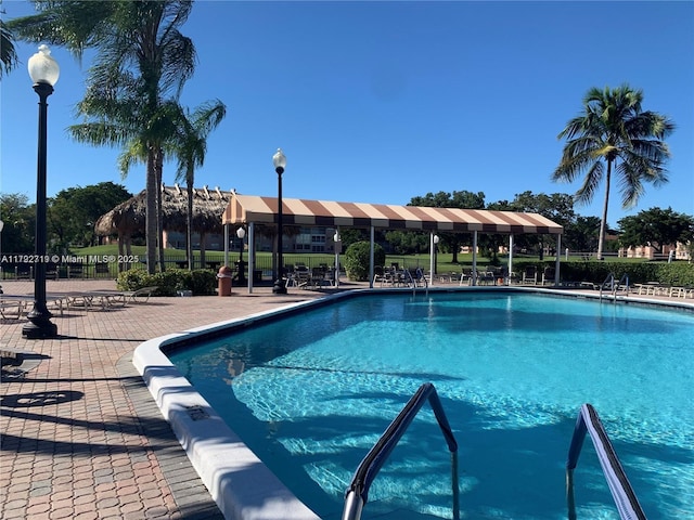 2900 N Pine Island Rd Unit 307, Sunrise, FL 33322 - community pool with a patio area