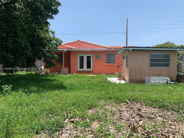 2381 SW 7th St, Miami, FL 33135 - rear view of property featuring french doors and stucco siding