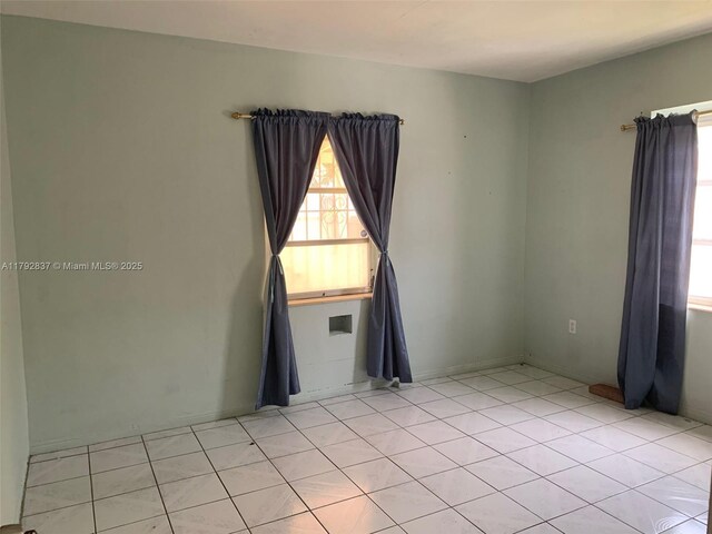 2381 SW 7th St, Miami, FL 33135 - unfurnished room with light tile patterned floors