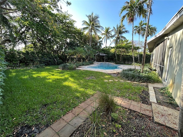 view of yard featuring a fenced backyard and an outdoor pool