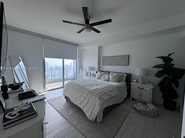 92 SW 3rd St Unit 3903, Miami, FL 33130 - bedroom with a ceiling fan, wood finished floors, and access to exterior