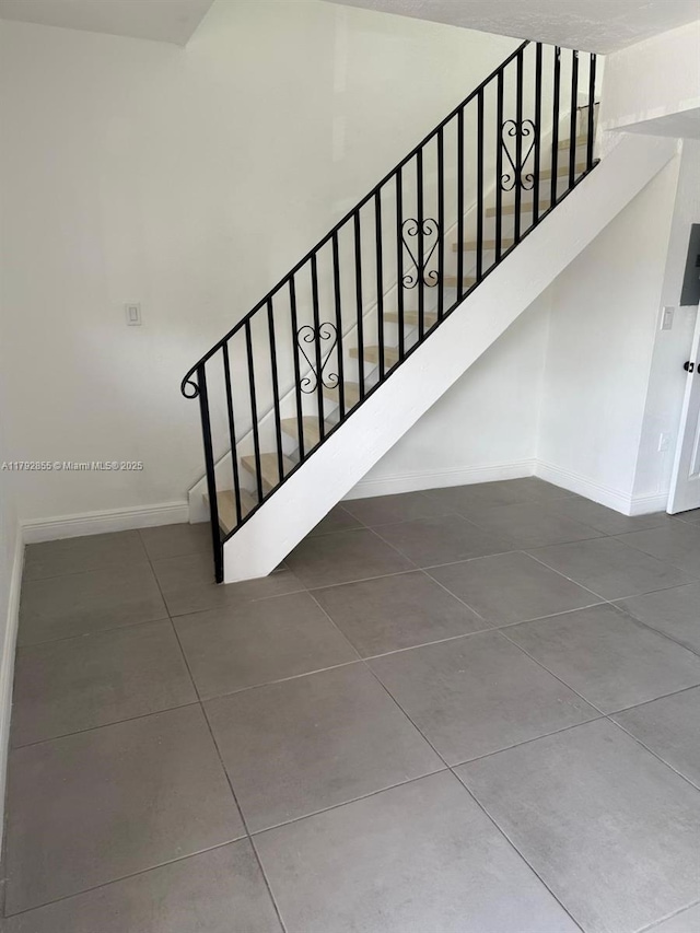 2291 W 53rd Pl Unit 2291, Hialeah, FL 33016 - stairway with tile patterned floors and baseboards