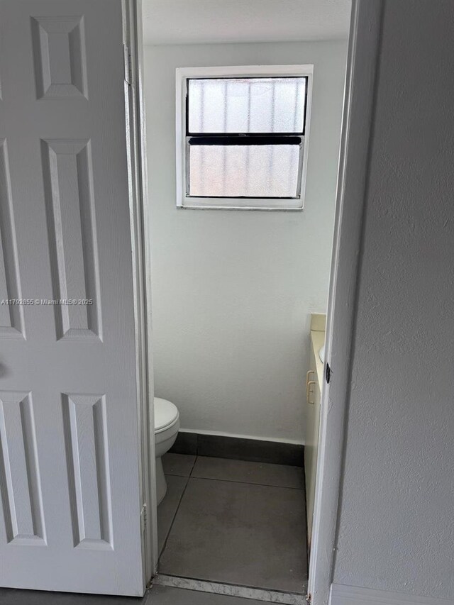 2291 W 53rd Pl Unit 2291, Hialeah, FL 33016 - bathroom featuring toilet and concrete floors