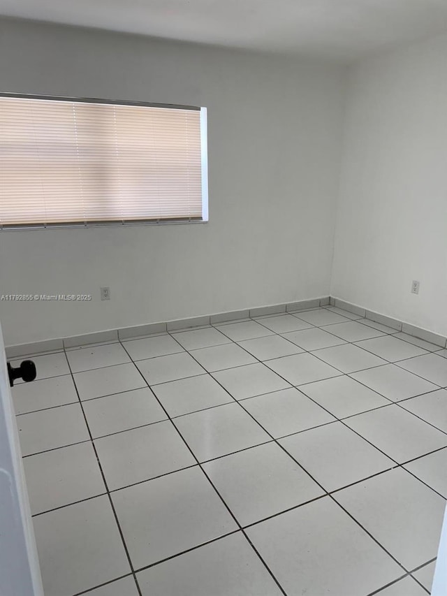 2291 W 53rd Pl Unit 2291, Hialeah, FL 33016 - unfurnished room featuring light tile patterned flooring
