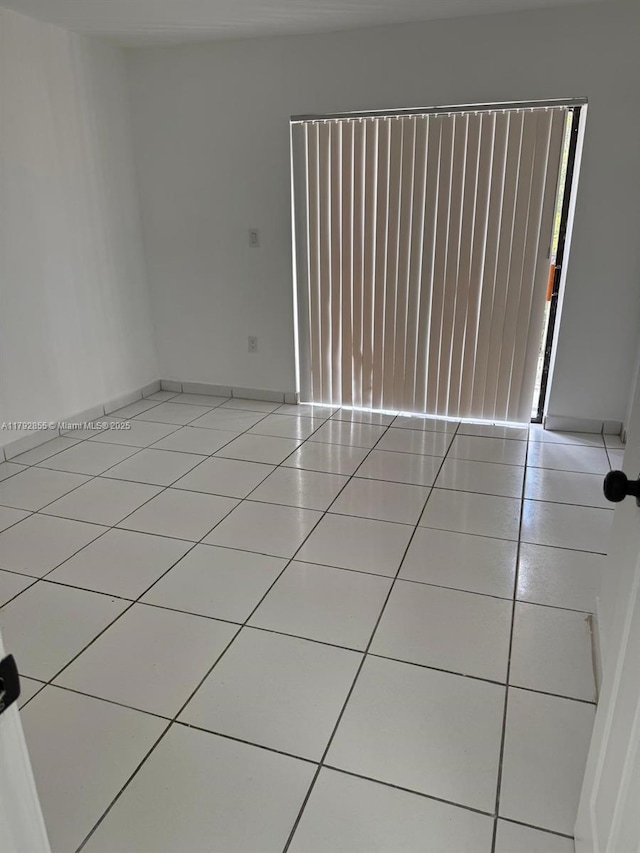 2291 W 53rd Pl Unit 2291, Hialeah, FL 33016 - empty room featuring tile patterned floors