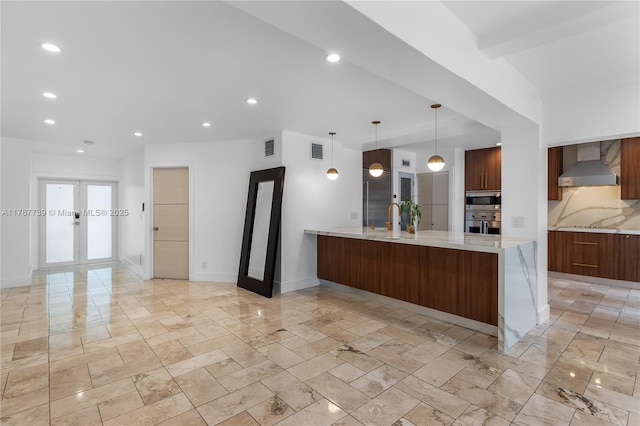 kitchen featuring appliances with stainless steel finishes, recessed lighting, wall chimney exhaust hood, and marble finish floor