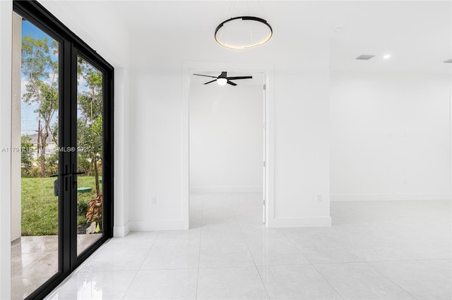 tiled spare room featuring baseboards, recessed lighting, ceiling fan, and visible vents