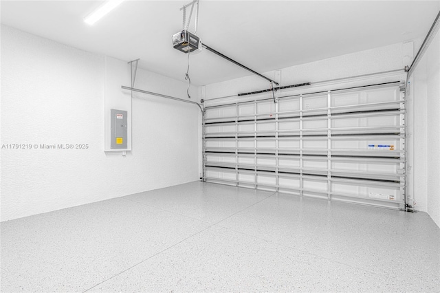 garage featuring a garage door opener and electric panel