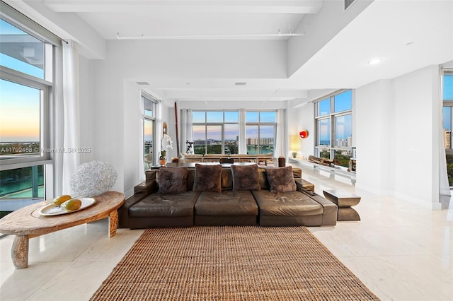 living room with recessed lighting, baseboards, and tile patterned floors