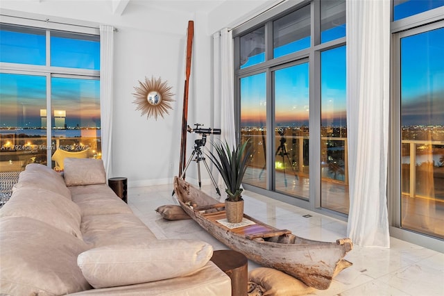 living area featuring marble finish floor